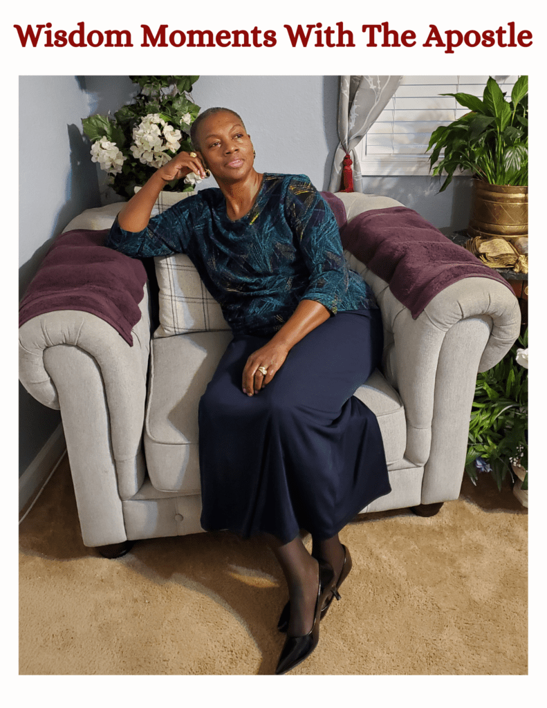 A woman sitting on top of a chair in a room.